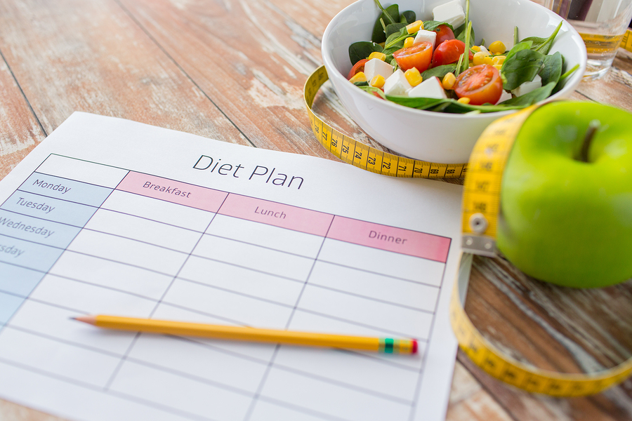 healthy eating, dieting, slimming and weigh loss concept - close up of diet plan paper green apple, : healthy eating, dieting, slimming and weigh loss concept - close up of diet plan paper green apple, measuring tape and salad